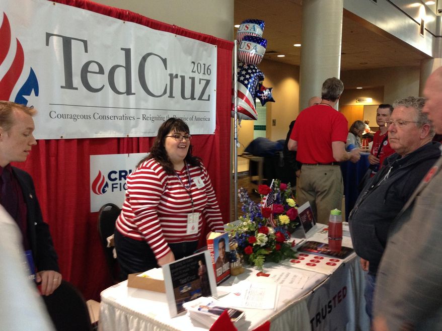 Jennifer Fetters of Bellevue, Wash., works the Ted Cruz booth at the Washington state GOP convention in Pasco, Wash., Thursday, May 19, 2016. More than 2,000 Republicans from across Washington are expected to attend the convention, which runs through Saturday. (AP Photo/Nicholas K. Geranios)