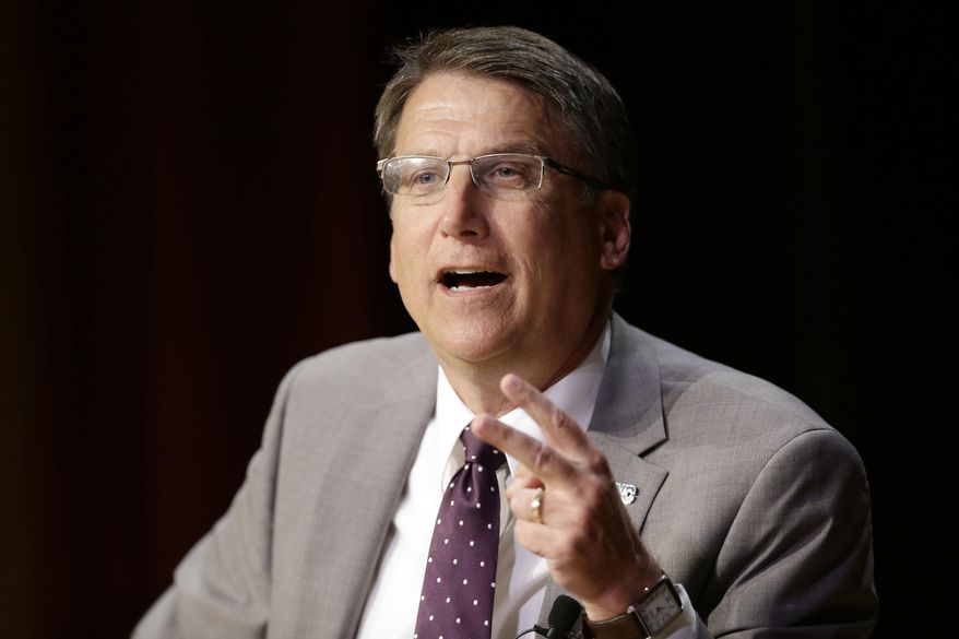 FILE - In this May 4, 2016 file photo, North Carolina Gov. Pat McCrory make remarks concerning House Bill 2 while speaking during a government affairs conference in Raleigh, N.C. McCrory has taken a beating from critics over a law dictating which restrooms transgender people can use, highlighting what they call the economic harm and reputation it’s causing North Carolina. McCrory is retrying to reshape the narrative heading into a tough re-election campaign by going after the federal government. (AP Photo/Gerry Broome, File)