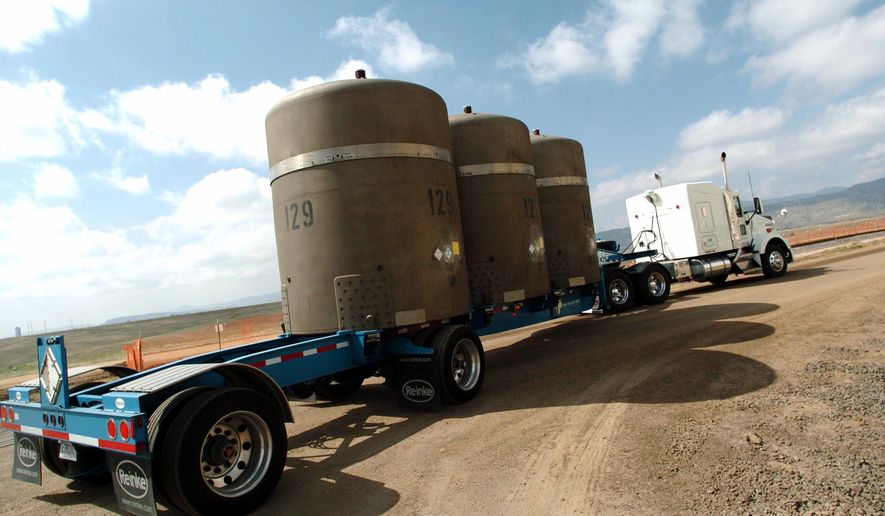 FILE -- In this April 19, 2005, file photo, the last of shipment of high-level radioactive waste is driven away from the former Rocky Flats nuclear weapons plant in Golden, Colo. Attorneys say they reached a $375 million settlement late Wednesday, May 18, 2016, in a legal battle between the operators of the former nuclear weapons plant outside Denver and thousands of homeowners who said plutonium releases from the plant hurt their property values. It must still be approved by a federal judge, and it could take months to set up a process for homeowners to file claims. (Sammy Dallal/The Daily Camera via AP, file) MANDATORY CREDIT