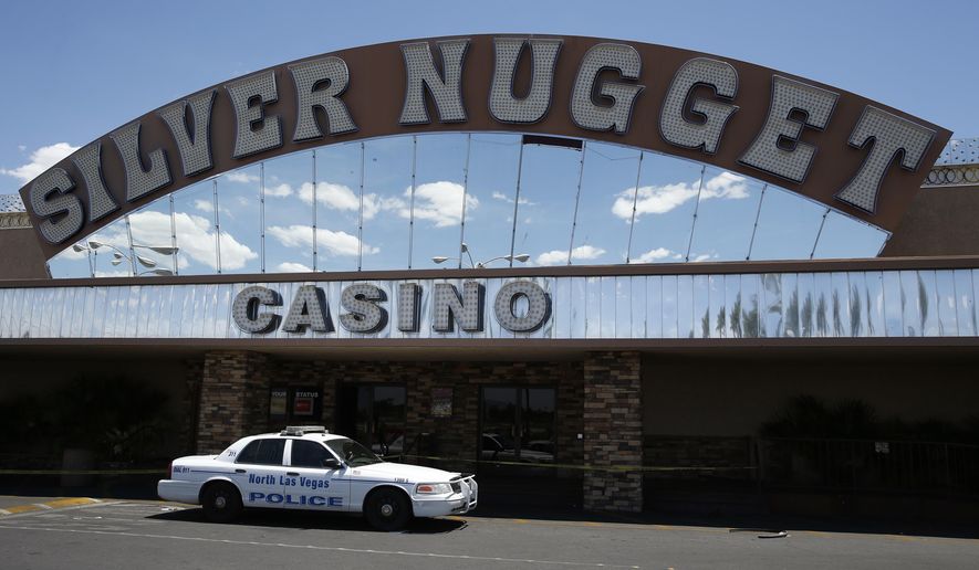 A North Las Vegas police car blocks the entrance to the Silver Nugget casino, Thursday, May 19, 2016, in North Las Vegas, Nev. North Las Vegas police officers were involved in a fatal shooting at the casino Thursday morning. (AP Photo/John Locher)