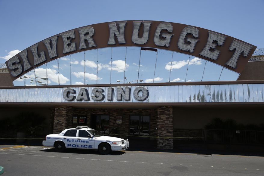 A North Las Vegas police car blocks the entrance to the Silver Nugget casino, Thursday, May 19, 2016, in North Las Vegas, Nev. North Las Vegas police officers were involved in a fatal shooting at the casino Thursday morning. (AP Photo/John Locher)