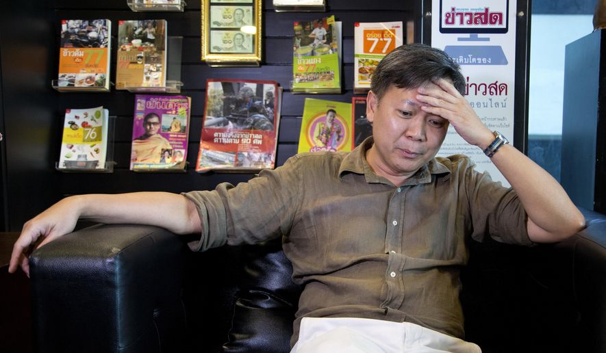 In this May 10, 2016 photo, Pravit Rojanaphruk, a Thai journalist who is one of the Thai junta's prominent critics gestures during an interview with the Associated Press in Bangkok, Thailand. "As a journalist, there's been a lot of self-censorship as well as the arbitrary detention of those who refuse to stop calling this regime illegitimate. I have been detained without charges twice." (AP Photo/Mark Baker)