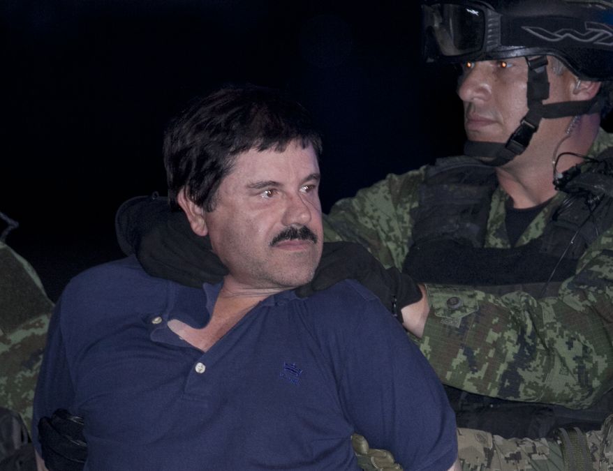 FILE - In this Jan. 8, 2016 file photo, Joaquin "El Chapo" Guzman is made to face the press as he is escorted to a helicopter in handcuffs by Mexican soldiers and marines at a federal hangar in Mexico City, Mexico. Mexico’s Foreign Relations department has ruled that the extradition of Guzman to the United States can go forward. The department said Friday, May 20, 2016 that the U.S. had guaranteed that Guzman would not face the death penalty, which is not applied in Mexico. The process can be appealed. (AP Photo/Marco Ugarte, File)