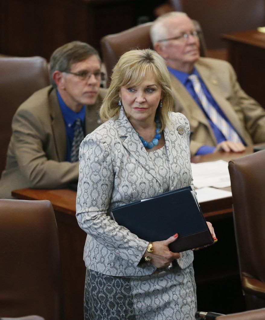 Oklahoma Gov. Mary Fallin walks on the floor of the Oklahoma House in Oklahoma City in this May 18, 2016, photo. Gov. Fallin has vetoed legislation that would make it a felony for doctors to perform an abortion, a measure that would have effectively outlawed the procedure in the state. (AP Photo/Sue Ogrocki, File)
