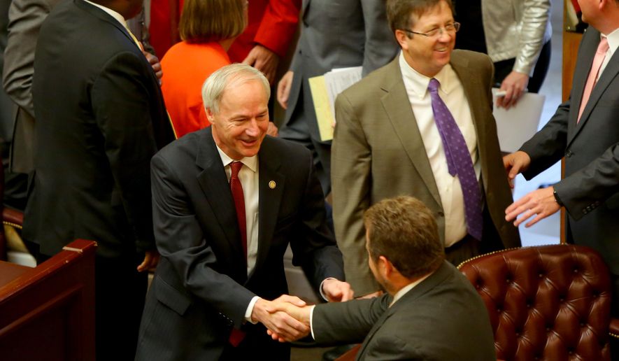 Gov. Asa Hutchinson, center, greets legislators before his address to a joint session of the Legislature as the 90th General Assembly convenes for the first day of its third special session at the State Capitol in Little Rock, Ark. on Thursday, May 19, 2016. (Stephen B. Thornton/The Arkansas Democrat-Gazette via AP) ARKANSAS TIMES OUT; ARKANSAS BUSINESS OUT; MANDATORY CREDIT