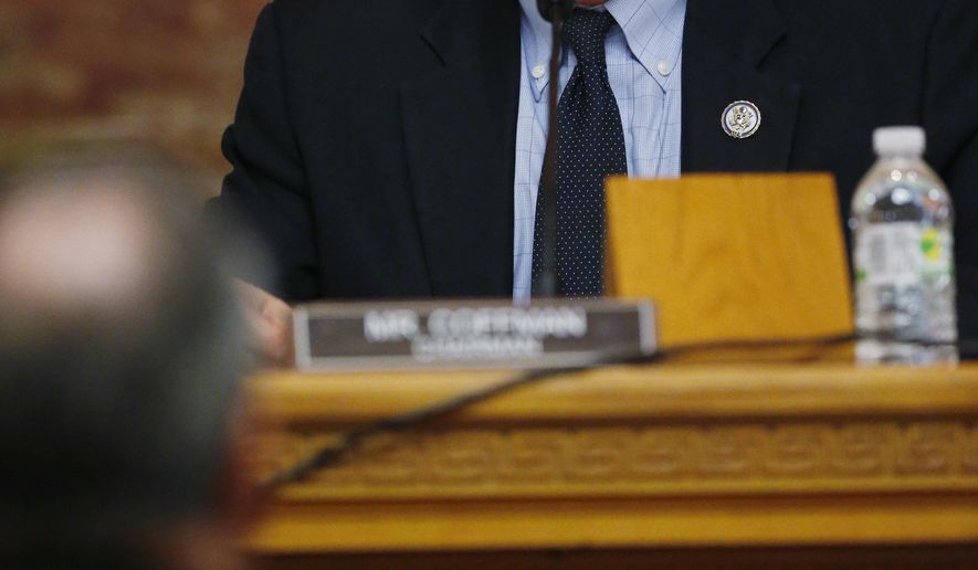 U.S. Rep. Mike Coffman,R-Colo , back, directs a question to a witness during a House Veterans Affairs subcommittee field hearing on VA hospitals and prescription drugs for veterans Friday, May 20, 2016, in the State Capitol in Denver. The House subcommittee heard from three Colorado-based VA officials during the field hearing. (AP Photo/David Zalubowski)