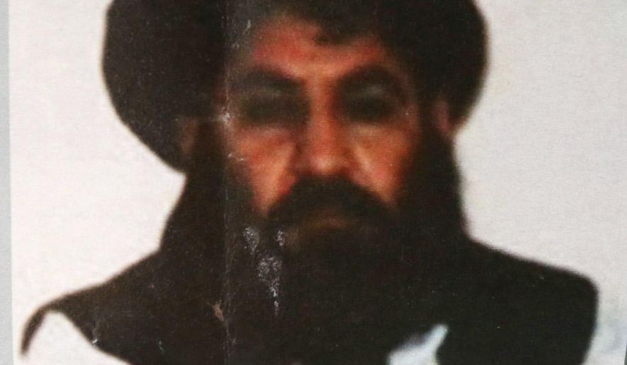 FILE - In this Saturday, Aug. 1, 2015 file photo, shows Taliban leader Mullah Mansour.  The U.S. conducted an airstrike Saturday, May 21, 2016, against the Taliban leader the Pentagon said, and a U.S. official said Mansour was believed to have been killed. Pentagon press secretary Peter Cook said the attack occurred in a remote region along the Afghanistan-Pakistan border. He said the U.S. was studying the results of the attack.  (AP Photo/Rahmat Gul, File)