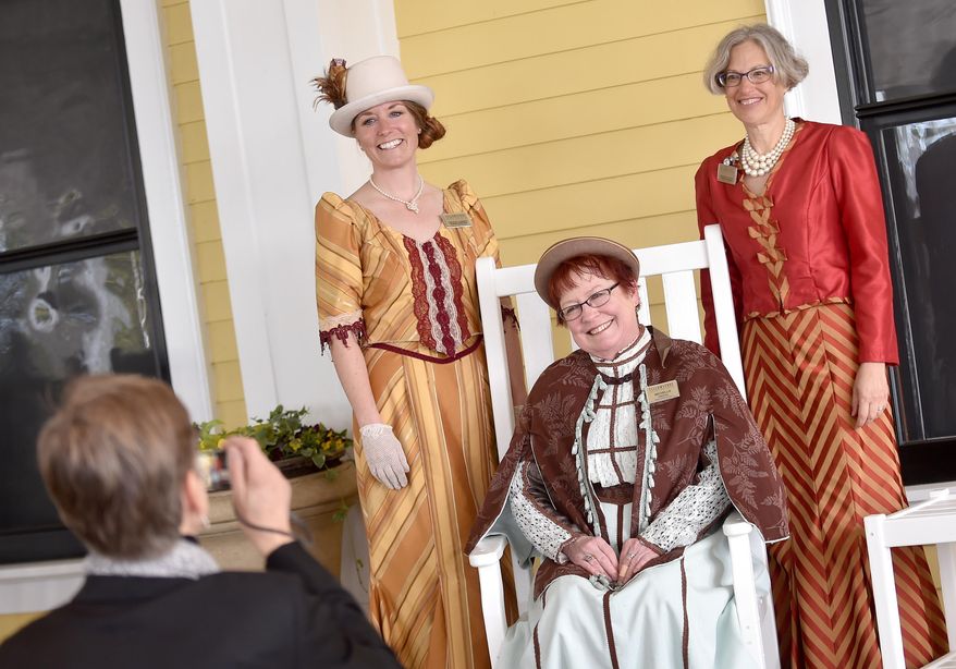 ADVANCE FOR THE WEEKEND OF MAY 21-22 AND THEREAFTER - In a May 13, 2016 photo, Yellowstone employees, from left, Crystal Cassidy, Michelle Trappen and Darla Kolk-Choquette wear period dresses during the 125th anniversary celebration of Lake Yellowstone Hotel. (Hannah Potes/The Billings Gazette via AP) MANDATORY CREDIT