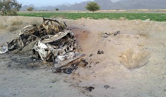 This photo taken by a freelance photographer Abdul Salam Khan using his smart phone on Sunday, May 22, 2016, purports to show the destroyed vehicle in which  Mullah Mohammad Akhtar Mansour was traveling in the Ahmad Wal area in Baluchistan province of Pakistan, near Afghanistan&#39;s border. A senior commander of the Afghan Taliban confirmed on Sunday that the extremist group&#39;s leader,  Mullah Mohammad Akhtar Mansour, has been killed in a U.S. drone strike. (AP Photo/Abdul Salam Khan)