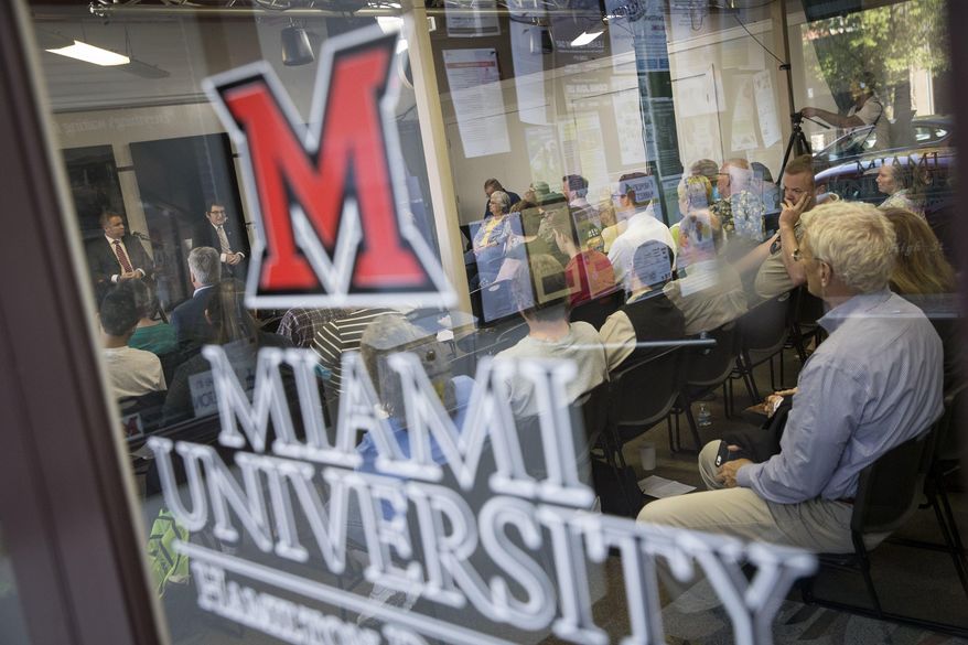 Audience members listen as candidates running for the 8th District speak at a forum at the Miami University Hamilton Downtown Center, Monday, May 23, 2016, in Hamilton, Ohio. The center hosted the candidates ahead of a June 7 special election to complete for John Boehner's vacated seat in Congress. (AP Photo/John Minchillo)