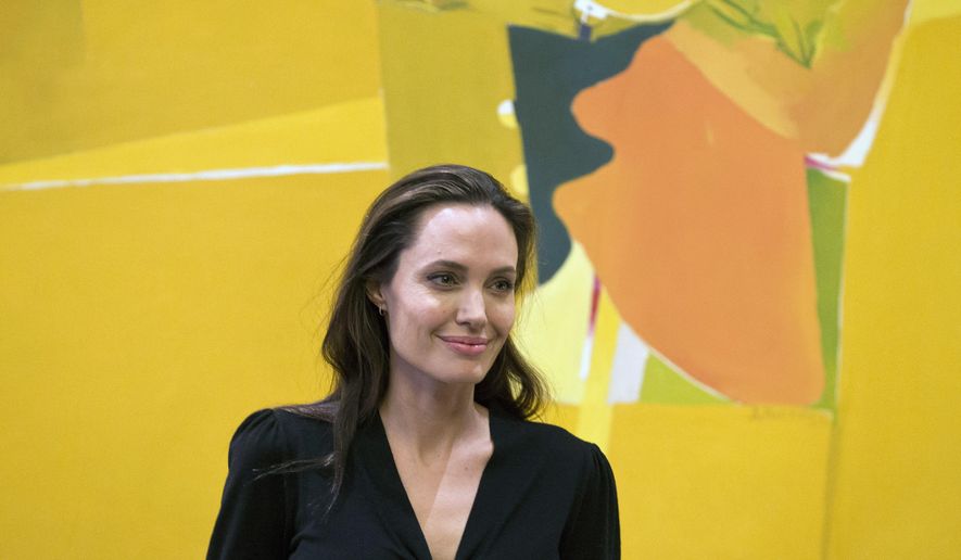 FILE - In this Wednesday, March 16, 2016 file photo, U.S. actress Angelina Jolie smiles during her meeting with Greek Prime Minister Alexis Tsipras, in Athens. Actress and campaigner Angelina Jolie has been appointed a visiting professor at one of Britain’s most prestigious universities. The London School of Economics announced Monday, May 23, 2016 that Jolie would be working with students studying for a master’s degree in Women, Peace and Security. (AP Photo/Petros Giannakouris, file)