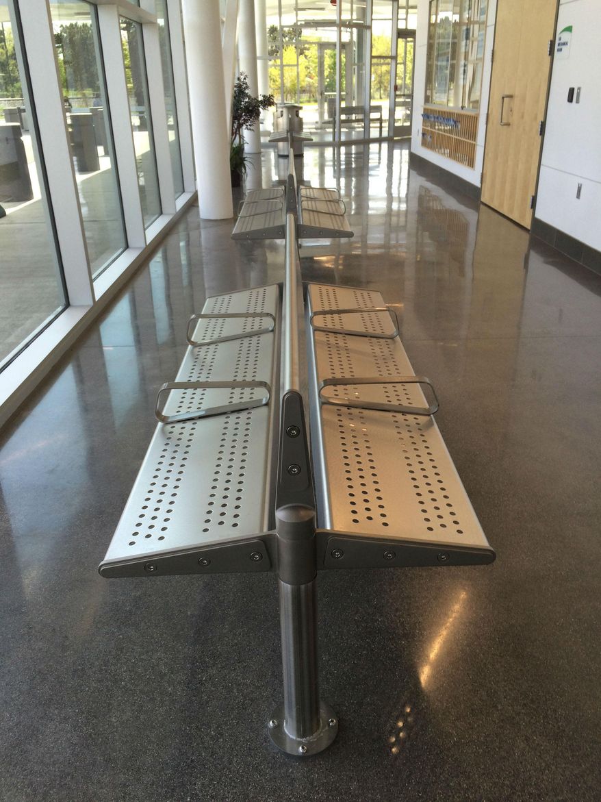 CORRECTS AMOUNT SPENT TO $24,000 NOT $23,000 - Benches are shown at the Capital Area Multimodal Gateway train and bus station in East Lansing, Michigan, on Thursday, May 19, 2016. Following complaints that the sloped benches were too slippery, the Capital Area Transportation Authority ordered $24,000 in benches with level seats. (Judy Putnam/Lansing State Journal via AP) NO SALES; MANDATORY CREDIT