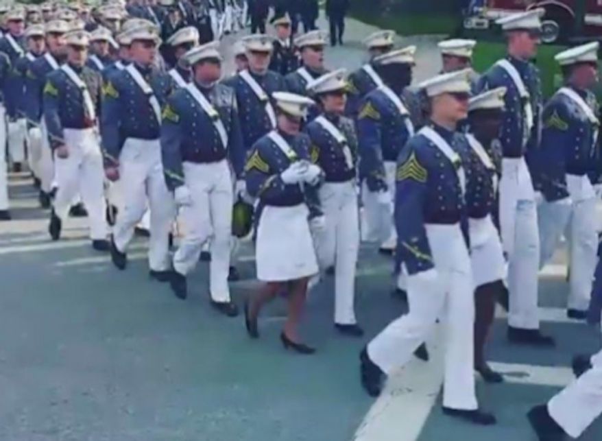 A video showing a West Point cadet apparently using her cellphone Saturday during a march to the prestigious military academy&#x27;s graduation ceremony has sparked backlash. (Facebook/@West Point)