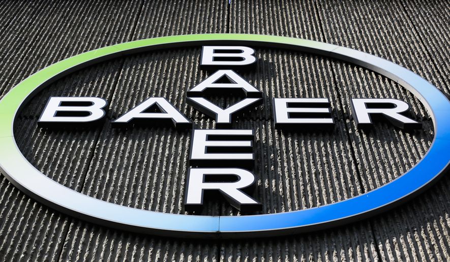 FILE - This Monday, May 23, 2016, file photo, shows the Bayer AG corporate logo displayed on a building of the German drug and chemicals company in Berlin. Monsanto is rejecting Bayer's $62 billion takeover bid, calling it "incomplete and financially inadequate. However, the seed company suggested Tuesday, May 24, 2016, that a higher bid might be accepted, saying that it remains open to talks. (AP Photo/Markus Schreiber, File)