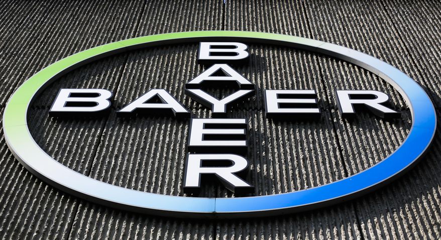 FILE - This Monday, May 23, 2016, file photo, shows the Bayer AG corporate logo displayed on a building of the German drug and chemicals company in Berlin. Monsanto is rejecting Bayer's $62 billion takeover bid, calling it "incomplete and financially inadequate. However, the seed company suggested Tuesday, May 24, 2016, that a higher bid might be accepted, saying that it remains open to talks. (AP Photo/Markus Schreiber, File)