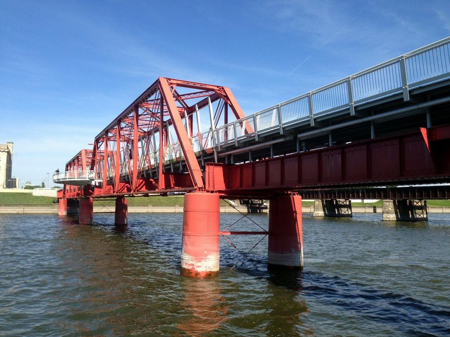 This photos shows the historic Red Bridge over the Des Moines River on Tuesday, May, 24, 2016, in Des Moines, Iowa. The bridge will close for a year as engineers work on raising it to meet flood rules. (AP Photo/Scott McFetridge)