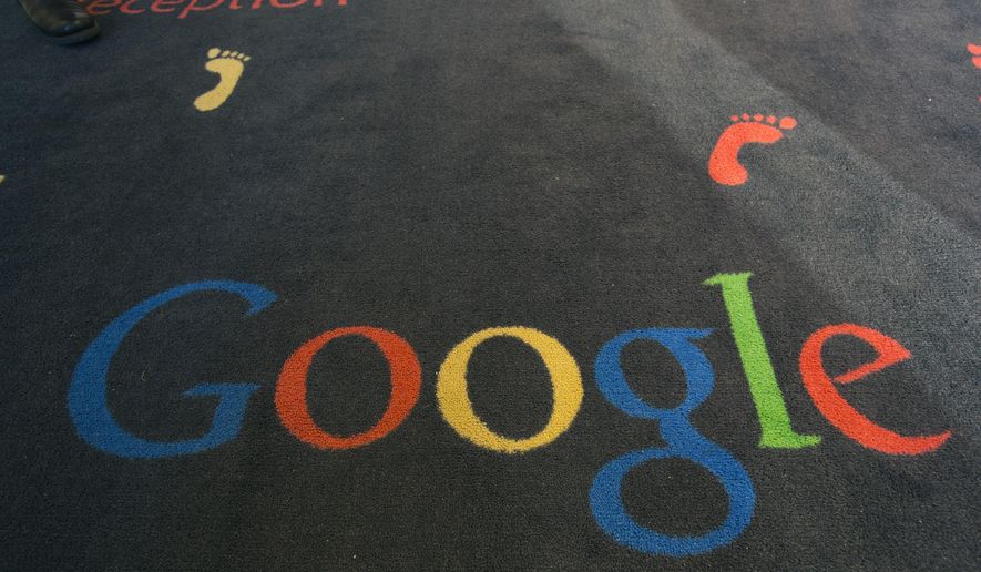 FILE - This Tuesday, Dec. 10, 2013 file photo shows the Google logo printed on a carpet during the inauguration of the new Google cultural institute in Paris, France. French police have raided Google's Paris offices as part of an investigation into "aggravated tax fraud" and money laundering, authorities said Tuesday. (AP Photo/Jacques Brinon, File)
