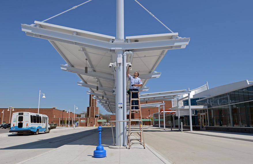 Garry Hunt, with Dyck Security, checks on some of the cameras Monday, May 23, 2016, at the Blue Water Transit Bus Center in Port Huron, Mich. Construction of a $9.8 million Blue Water Area Transit bus hub is nearing completion. (Andrew Jowett/The Times Herald via AP) NO SALES; MANDATORY CREDIT