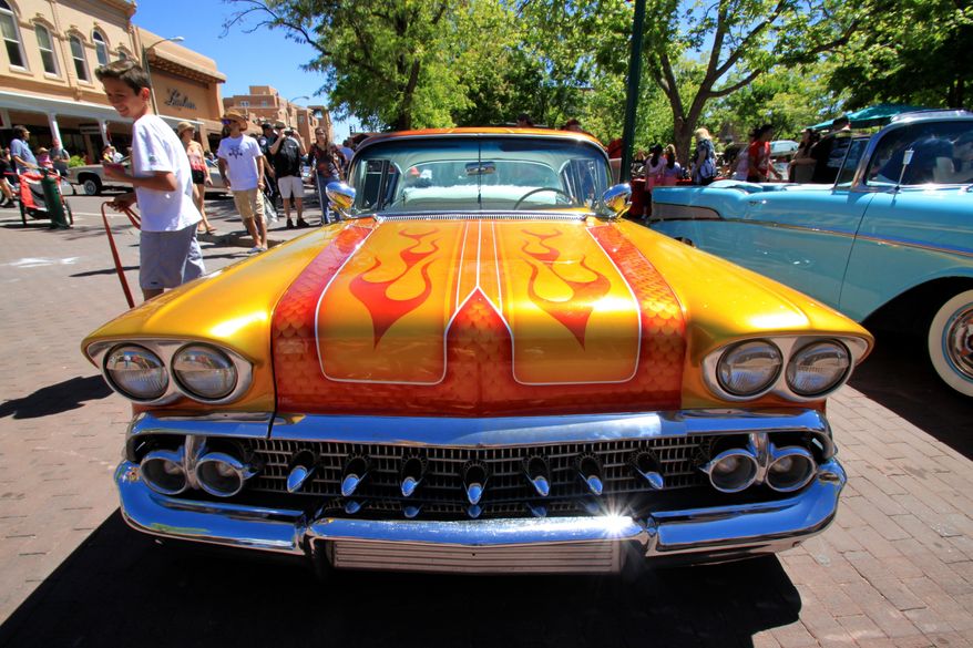 This May 22, 2016 photo shows one of the dozens of lowriders on display at the historic plaza in downtown Santa Fe, N.M., as part of the city's Lowrider Summer celebration, which includes a pair of exhibitions at the New Mexico History Museum and the New Mexico Museum of Art. (AP Photo/Susan Montoya Bryan)