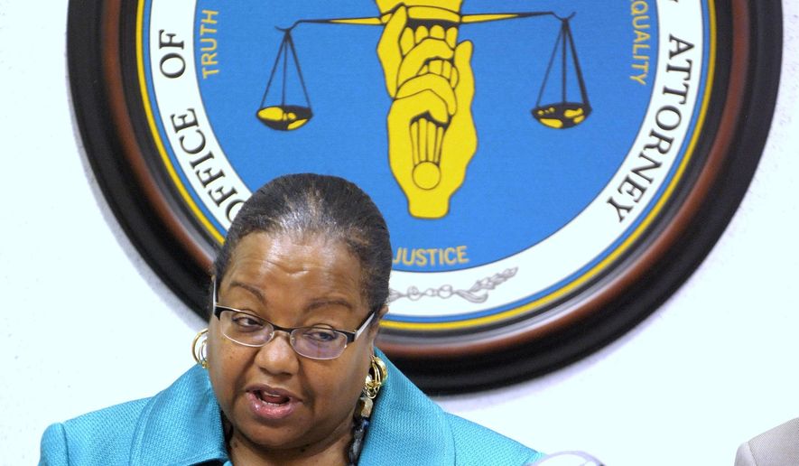 Wayne County Prosecutor Kym Worthy announces charges against individuals involved in the gun violence deaths of children in Detroit, Wednesday morning, May 25, 2016. (Todd McInturf, The Detroit News via AP)