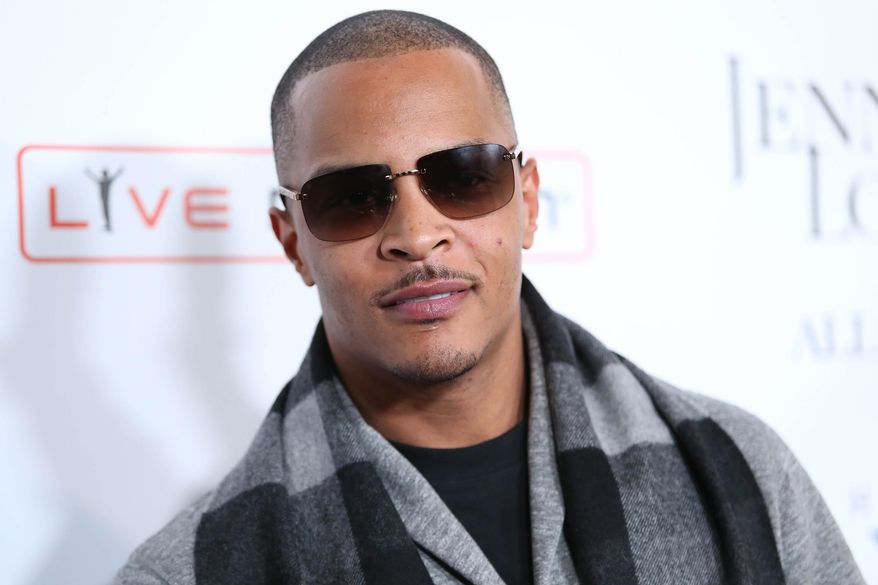 FILE- In this Jan. 20, 2016, file photo, T.I. arrives at the grand opening of "Jennifer Lopez: All I Have" show at Planet Hollywood Resort & Casino in Las Vegas. According to authorities several people were shot at a T.I concert in New York, Wednesday, May 25, 2016. (Photo by Omar Vega/Invision/AP, File)