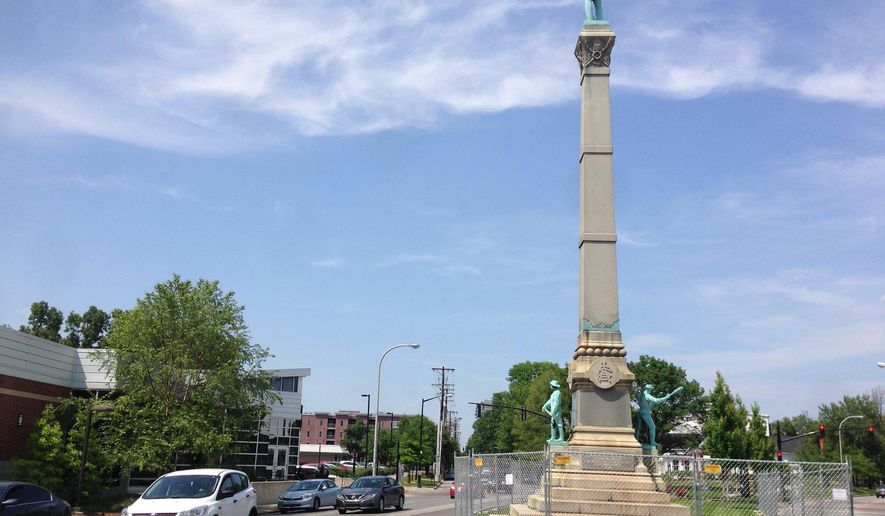 In this Tuesday, May 24, 2016 photo, a stone monument to Confederate soldiers killed in the Civil War sits near the University of Louisville in Louisville, Ky. A judge has ended a restraining order that barred the city of Louisville from removing the 120-year-old monument to Confederate soldiers. (AP Photo/Dylan Lovan)