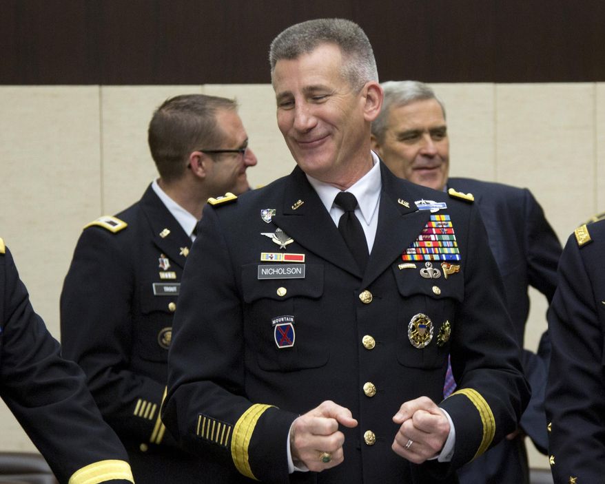 In this May 20, 2016, photo, Commander of Resolute Support Gen. John Nicholson during a meeting of the North Atlantic Council with Resolute Support Operational Partner Nations at NATO headquarters in Brussels. Afghan civilians who assisted the American-led coalition as interpreters, firefighters and construction workers could be in serious danger if Congress cancels a program that allows them to resettle in the United States, according to the top American commander in Afghanistan. The warning from Nicholson comes with the future of the so-called special immigrant visa program in doubt as the Senate opens up debate May 25 on the annual defense policy bill. (AP Photo/Virginia Mayo)