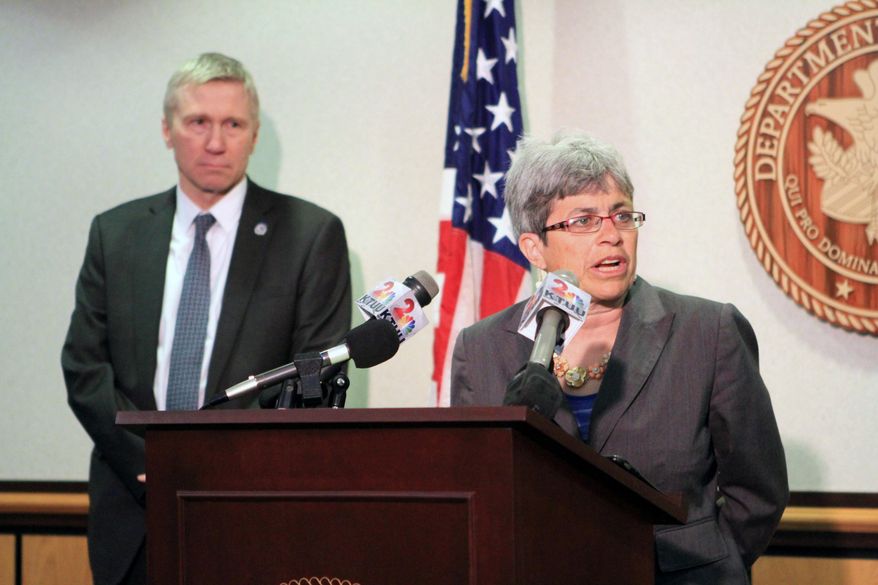 Alaska Department of Corrections Commissioner Dean Williams listens as U.S. Attorney for Alaska Karen Loeffler speaks about the arrest of a state corrections officer at a news conference on Wednesday, May 25, 2016, in Anchorage, Alaska. Corrections officer Adam Jason Spiller is charged with two federal drug counts at a state prison outside Wasilla including conspiracy to distribute heroin. (AP Photo/Dan Joling)