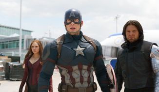 This image released by Disney shows Elizabeth Olsen, left, Chris Evans and Sebastian Stan in a scene from Marvel&#39;s &amp;quot;Captain America: Civil War.&amp;quot;  (Disney/Marvel via AP) ** FILE **