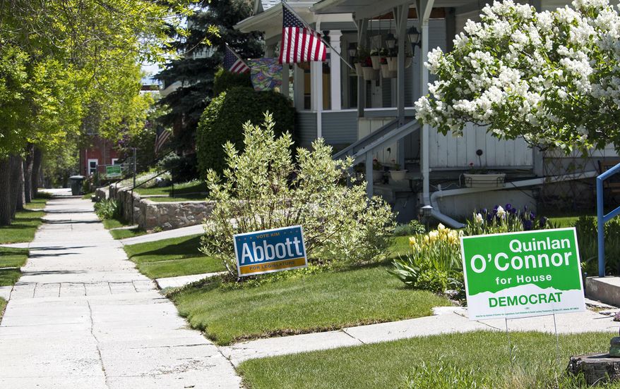 Yard signs for Democrats Kim Abbott and Quinlan O’Connor have been popping up across Helena, Montana, for House District 83. The race is among the most high-profile legislative contests in the June 7 Democratic primary. The homeowner, Bonnie Bowler, planted signs for both candidates on her lawn – not realizing, she says, that both were running for the same House district. Now, she doesn’t have the heart to uproot one over the other. (AP Photo/Bobby Caina Calvan)