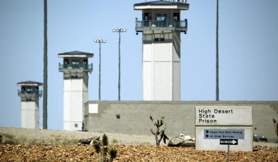 FILE - This April 15, 2016 file photo shows guard towers are seen at High Desert State Prison in Indian Springs, Nev. The state official hired in March to change the culture of guards and inmates in Nevada's prisons has posted a mission statement promising to shift the system toward inmate rehabilitation, in an effort to protect the public. (AP Photo/John Locher, File)