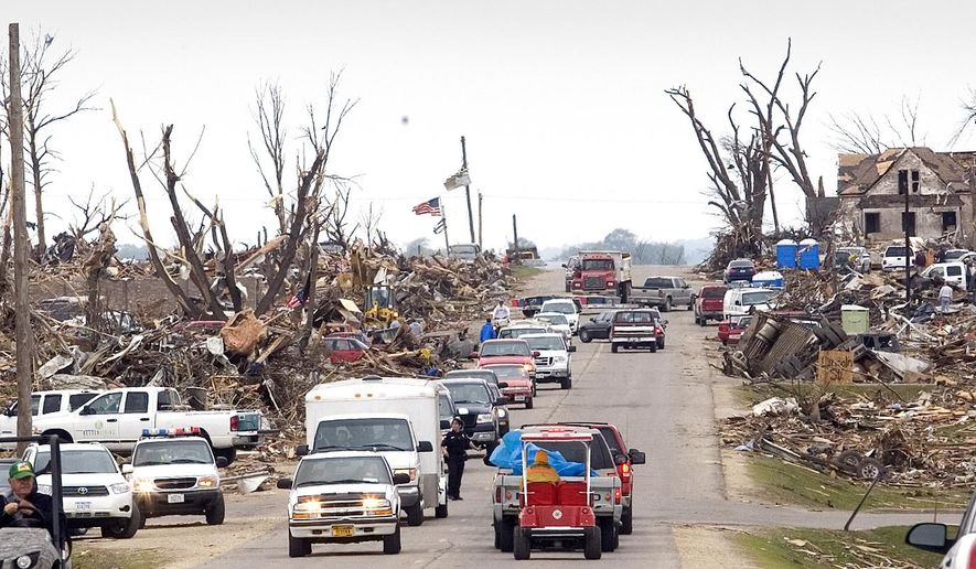This May 25, 2008 photo shows damage to a neighborhood, west along Highway 57 in Parkersburg, Iowa after an EF5 tornado passed through the town. It's been eight years since a massive tornado destroyed nearly 300 homes and killed nine people in Parkersburg, and city leaders say the northern Iowa town's revival is a model for other communities recovering from natural disasters. (Rick Chase/The Courier via AP) MANDATORY CREDIT