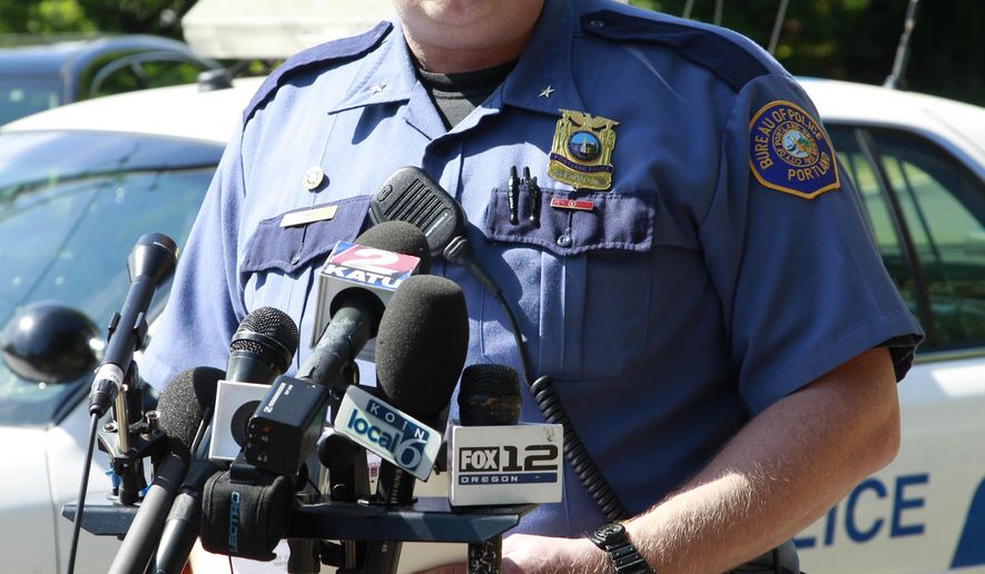 FILE--In this July 15, 2011, file photo, Portland police officer Larry O'Dea speaks during a news conference in Portland, Ore. Portland's mayor has placed O'Dea, currently the city's Police Chief, on administrative leave stemming from the chief's ties to a late-April 2016shooting incident, which is currently under investigation. Hales' decision comes a day after authorities determined O'Dea initially didn't tell the truth about who shot who during the encounter. (AP Photo/Rick Bowmer, file)