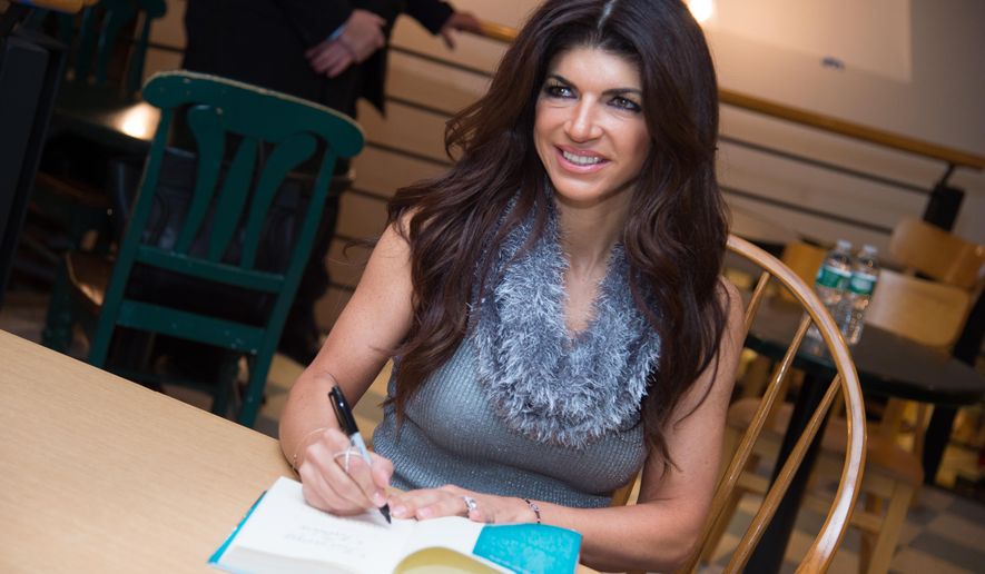 FILE - In this Feb. 16, 2016, file photo, television personality Teresa Giudice attends a book signing for her new book "Turning the Tables: From Housewife to Inmate and Back Again," at Book Revue in Huntington, N.Y. A federal judge has reopened a bankruptcy case for "Real Housewives of New Jersey" cast member Giudice, who pleaded guilty in 2014 to bankruptcy fraud. (Photo by Scott Roth/Invision/AP, File)