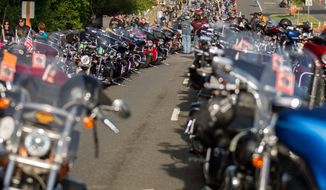 Hundreds of bikes line Route 50 outside of the Patriot Harley-Davidson in Fairfax as volunteers and riders prepare for the annual Ride of the Patriots in support of Rolling Thunder.