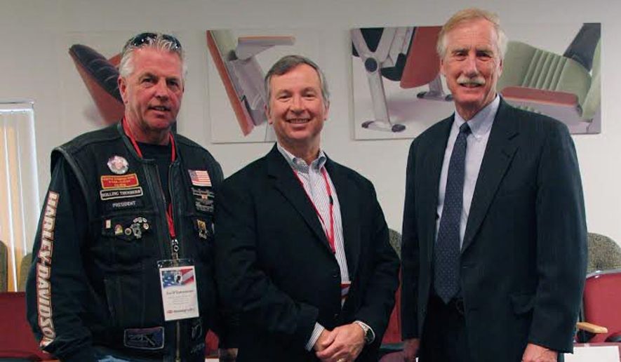 Tim Hussey, CEO of Hussey Seating Co., stands between Maine Sen. Angus S. King Jr. (right) and Rolling Thunder leader Joe D&#39;Entremont with a POW/MIA commemorative chair. The family-owned company, based in North Berwick, Maine, is a partner in the effort to place these chairs in public venues as a reminder of veterans who are missing or held captive. (Hussey Seating Co.)
