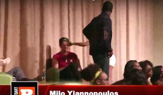 A Black Lives Matter supporter and student activist hits Milo Yiannopoulos in the face with a microphone at DePaul University. (YouTube, Breitbart News)