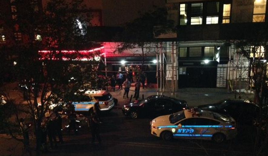 Authorities stand outside Irving Plaza, near Manhattan's Union Square in New York after a shooting Wednesday, May 25, 2016. Police say several were injured in a deadly shooting inside the concert venue, where hip-hop artist T.I. was scheduled to perform. (AP Photo/Dana Schimmel)