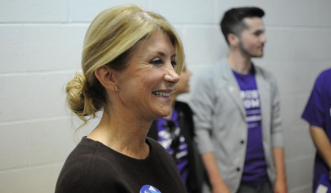 Former Texas state Sen. Wendy Davis speaks in support of then-Democratic presidential hopeful Hillary Clinton to South Dakotans as the candidate who would look out for women to the benefit of the nation&#x27;s economy, Thursday, May 26, 2016, at the opening of Clinton&#x27;s first South Dakota office. (AP Photo/James Nord) ** FILE **