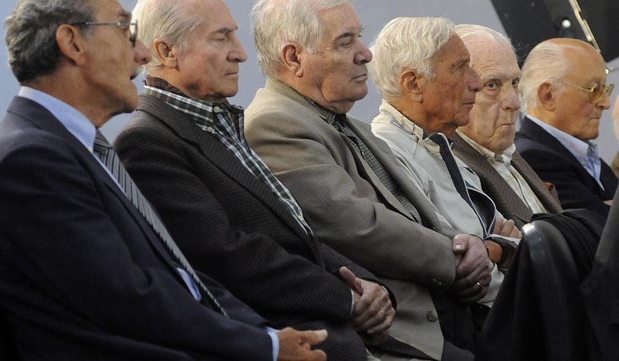 FILE - In this Nov. 2, 2009 file photo, former military, police and Argentina's last dictator attend the start of their trial in connection with human rights abuses during Argentina's dirty war in Buenos Aires. Argentina's last dictator and 14 other former military officials were sentenced to prison on Friday, May 27, 2016 for human rights crimes committed during the Operation Condor conspiracy to hunt down dissidents across the region. From left to right are former police officer German Montenegro, former army officers Jorge Osvaldo Garcia, Carlos Tepedino, Eugenio Guanabens, former and last dictator Gen. Reynaldo Bignone and former Gen. Omar Rivero. (AP Photo/Rolndo Andrade Stracuzzi, File)