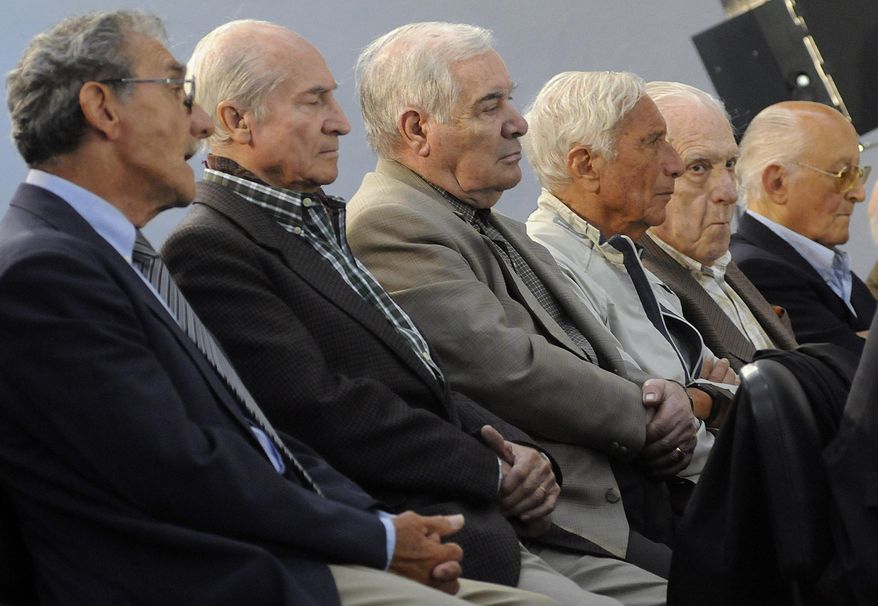 FILE - In this Nov. 2, 2009 file photo, former military, police and Argentina's last dictator attend the start of their trial in connection with human rights abuses during Argentina's dirty war in Buenos Aires. Argentina's last dictator and 14 other former military officials were sentenced to prison on Friday, May 27, 2016 for human rights crimes committed during the Operation Condor conspiracy to hunt down dissidents across the region. From left to right are former police officer German Montenegro, former army officers Jorge Osvaldo Garcia, Carlos Tepedino, Eugenio Guanabens, former and last dictator Gen. Reynaldo Bignone and former Gen. Omar Rivero. (AP Photo/Rolndo Andrade Stracuzzi, File)