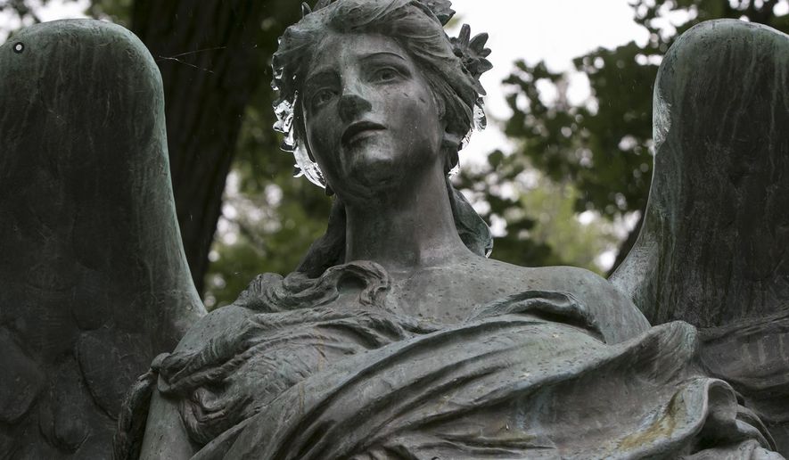 This May 28, 2016 photo shows the Ruth Anne Dodge Memorial, often referred to as the Black Angel in Council Bluffs, Iowa. Council Bluffs officials and resident have spent nearly $10,000 on a 3-D image of a historic statue to ensure the artwork can be restored if it&#x27;s ever damaged. (Joe Shearer/The Daily Nonpareil via AP) MANDATORY CREDIT