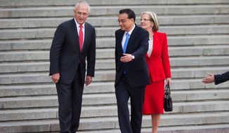 Chinese Premier Li Keqiang welcomed Australian Prime Minister Malcolm Turnbull and his wife, Lucy, to Beijing in April. The delicate relationship between their countries is about to change. (Associated Press)