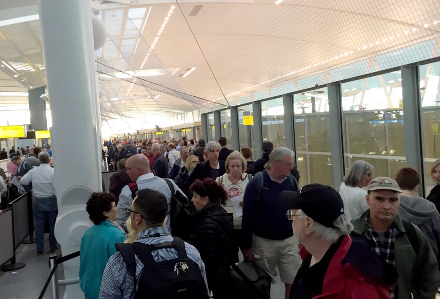 Passengers wait in a long Transportation Security Administration security line at New York's John F. Kennedy International Airport during the morning rush on Monday, May 9, 2016. (AP Photo/Scott Mayerowitz) ** FILE **