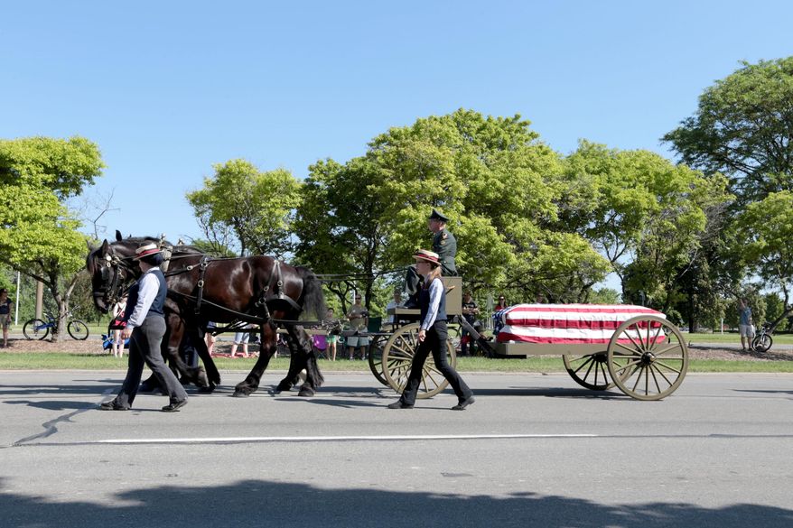 A military funeral cortege is shown in this file photo via the Detroit Free Press (Jessica J. Trevino/Detroit Free Press via AP) DETROIT NEWS OUT; TV OUT; MAGAZINES OUT; NO SALES; MANDATORY CREDIT DETROIT FREE PRESS **FILE**