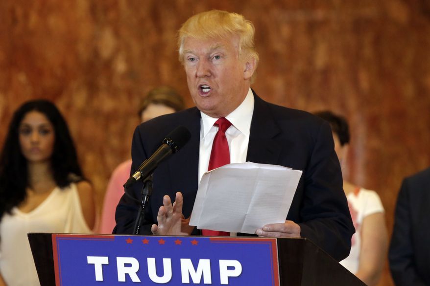 Republican presidential candidate Donald Trump reads from a list of donations to veteran's groups, during a news conference in New York, Tuesday, May 31, 2016. (AP Photo/Richard Drew)