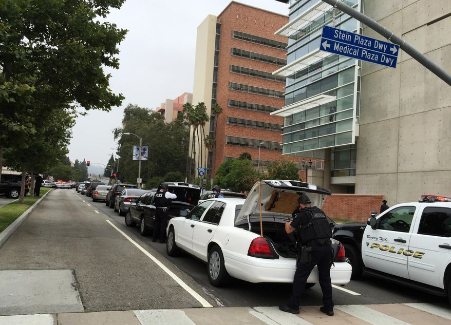 Police work at the scene of a shooting at the University of California, Los Angeles, Wednesday, June 1, 2016, in Los Angeles. (AP Photo/Ringo H.W. Chiu)