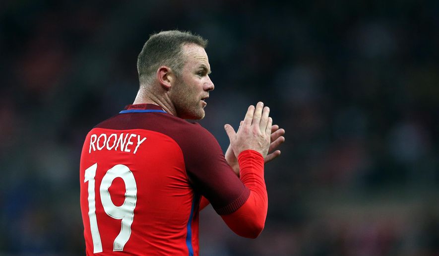 FILE - In this Friday, May 27, 2016 file photo, England&#39;s captain Wayne Rooney applaudes to his teammates during the international friendly soccer match between England and Australia at the Stadium of Light, Sunderland, England. (AP Photo/Scott Heppell)