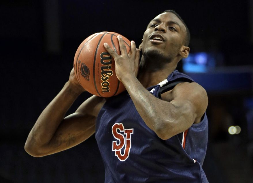 FILE - In this March 19, 2015, file photo, Rysheed Jordan grabs a rebound during practice at the NCAA college basketball tournament in Charlotte, N.C. ahead of an NCAA tournament game. Police say Jordan has been charged in connection with a May 27, 2016, shooting in Philadelphia. (AP Photo/Gerald Herbert, File)