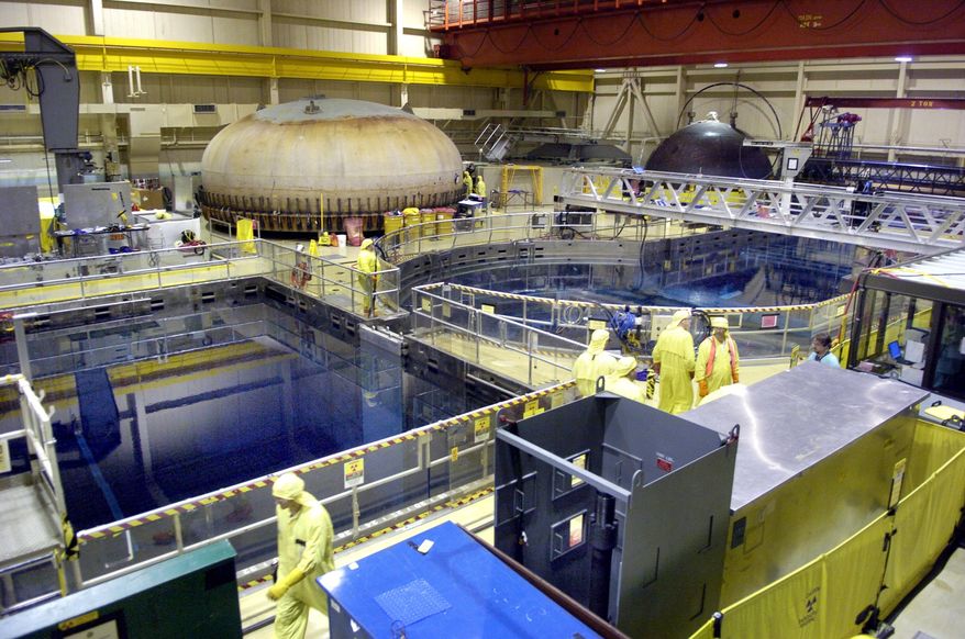 FILE - In this May 16, 2006 file photo, employees and contractors work inside Quad Cities Generating Station at the Exelon Nuclear plant in Cordova, Ill. Exelon Corp. says it will shut two Illinois nuclear plants after the Illinois Legislature declined to act on its request for financial support. The Chicago-based power provider said Thursday June 2, 2016 that it will close the Clinton Power Station in Clinton on June 1, 2017, and the Quad Cities Generating Station in Cordova on June 1, 2018. (Antonio Perez/Chicago Tribune via AP) MANDATORY CREDIT CHICAGO TRIBUNE; CHICAGO SUN-TIMES OUT; DAILY HERALD OUT; NORTHWEST HERALD OUT; THE HERALD-NEWS OUT; DAILY CHRONICLE OUT; THE TIMES OF NORTHWEST INDIANA OUT; TV OUT; MAGS OUT; NO SALES